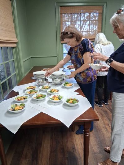 Ginny Hornsby and Mary Garrison getting their meals for dinner after play