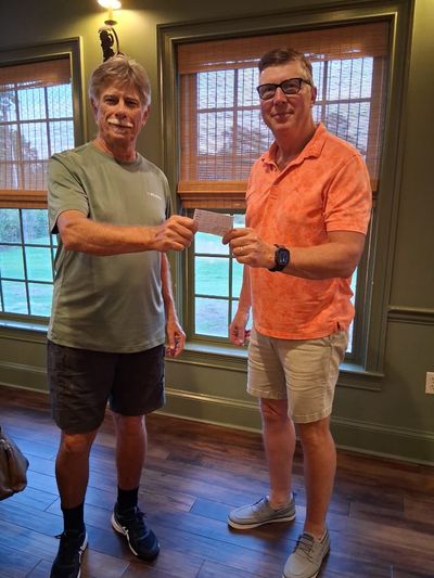 Court Sports President William Treichel and the men's winner Jeff Shew